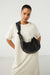 Knotted sling bag in black — main image