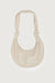 Knotted sling bag in sandstone — main image