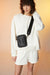 Crossbody pouch in black — main image