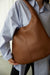Round shoulder bag in dark brown — main image