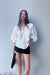 Ruffled v-neck blouse in white — main image