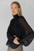 Ruffled long sleeve blouse in black — image