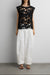 Floral guipure lace woven top in black — main image