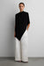 Asymmetrical drape cape top in black — main image