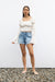 Ruffle blouse in cream — main image
