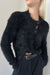 Cropped asymmetrical cardigan in black — main image