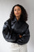 Vegan leather bubble hem bomber jacket in black — main image