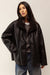 Oversized vegan suede sherpa jacket in black — main image