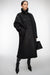 Long vegan suede sherpa coat in black — main image