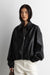 Puffed vegan leather bomber jacket with pleats in black — main image