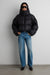 Oversized hooded down fill puffer jacket in black — main image