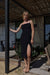 Midi ruched dress with side slit in black — main image