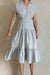 Tiered midi dress with cutouts in pearl blue — main image