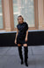 Asymmetrical bat sleeve mini dress in black — main image