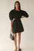 Puff sleeve mini dress with cutouts in black — main image