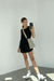 Nylon cargo mini dress in black — main image