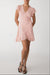 Wrap mini dress with ruffled hem in evening sand — main image