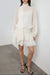 Mockneck long sleeve sheer ruffled mini dress in cream — main image