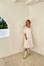 Smocked midi dress in cream — main image