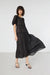 Puff sleeve tiered dress in black — main image