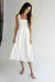 Square neck pleated dress in white — main image