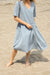 Striped seersucker flowy dress in whale blue stripe — main image