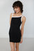 Contrast shoulder strap mini dress in black — main image