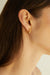 Floral dotted hoops in gold — main image
