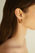 Double layered hoop stone earring in brown gold — main image