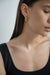 Thick hoop earring with green gemstone in gold — main image