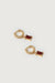 Twisted hoop with zirconia in red gold — main image