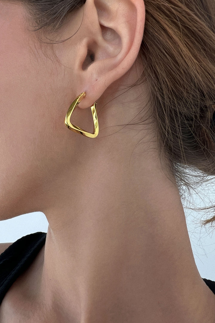 TRIANGULAR TWIST HOOP EARRINGS in Gold — alternate angle