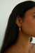 Hoop earring with tiny bar pendant in gold — main image
