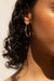 Large tear drop hoops in gold — main image