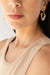 Abstract squiggle hoop earring in gold — main image