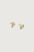 Sparkly bow stud earrings in gold — main image