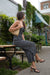 Printed sleeveless jumpsuit in black print — main image