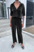 Pleated jumpsuit in black — main image