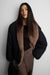 Reversible faux fur puffer jacket in black — main image