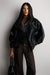 High funnel neck vegan leather jacket in black — main image