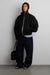 Structured funnel neck jacket in black — main image