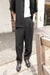 Crinkled pleated trouser in black — main image