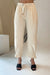 Tapered pant with belt in oatmeal — main image