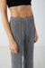 Houndstooth pleated pant in black — image