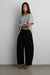 Petite relaxed pleated wide leg pant in black — main image
