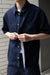 Oversized short sleeve denim shirt in raw blue denim — main image