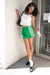 Track shorts with lace piping in green — main image