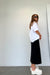 Midi skirt with front pleat in black — main image