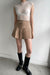 Pleated twill mini skirt in tan — main image
