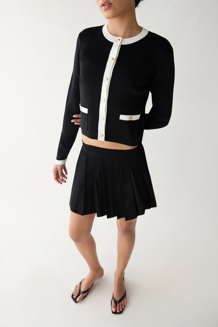 PLEATED KNIT MINI SKIRT in Black — alternate angle